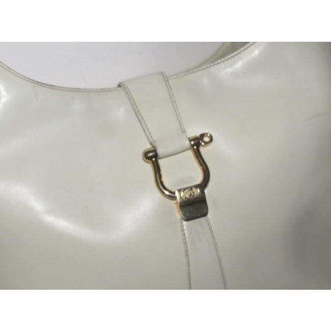 Early, Gucci, Jackie supple off-white colored leather XL hobo style shoulder bag with a gold horse-bit closure and accents, and two settings for the strap's length | AlmaBagz - Image 4