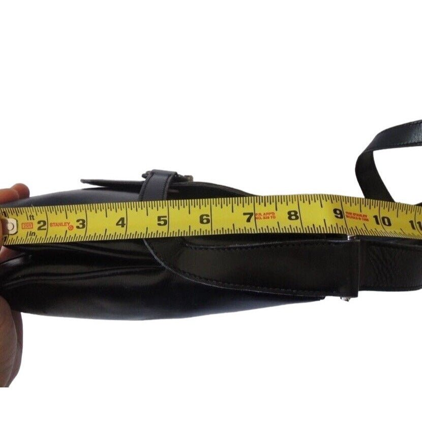 1970s Gucci saddle bag in black leather with muted gold hardware, an expandable bottom, wide shoulder strap, and burgundy leather lining | AlmaBagz - Image 11