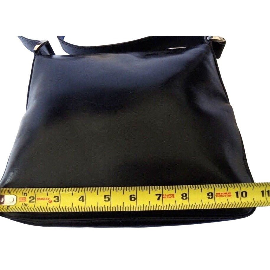 1970s Gucci saddle bag in black leather with muted gold hardware, an expandable bottom, wide shoulder strap, and burgundy leather lining | AlmaBagz - Image 7