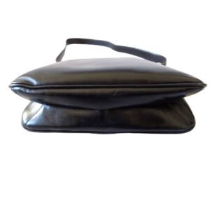 1970s Gucci saddle bag in black leather with muted gold hardware, an expandable bottom, wide shoulder strap, and burgundy leather lining | AlmaBagz