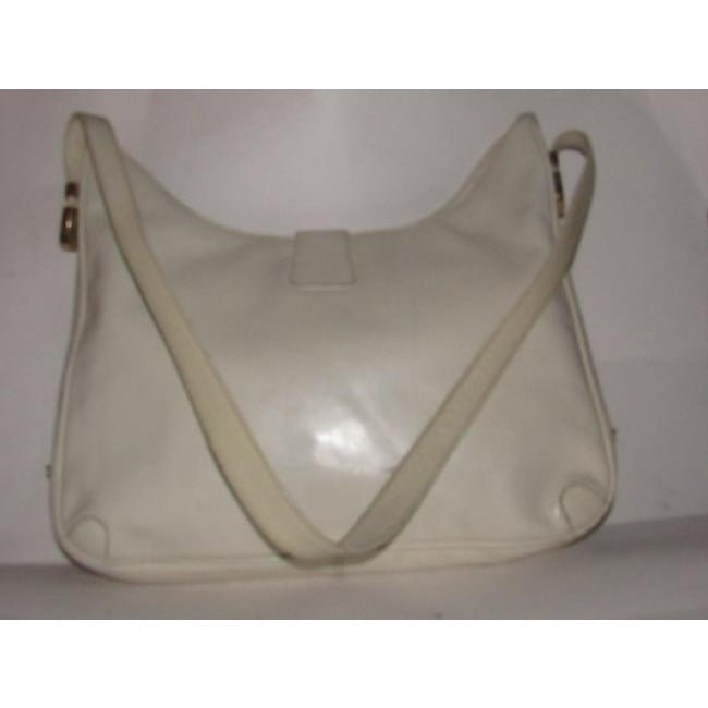 Early, Gucci, Jackie supple off-white colored leather XL hobo style shoulder bag with a gold horse-bit closure and accents, and two settings for the strap's length | AlmaBagz