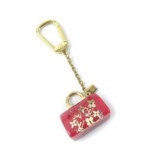 LOUIS VUITTON key ring M65024 Gold Plated Red gold Portocle Speedy Inclusion | AlmaBagz