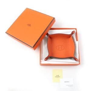HERMES Other accessories Taurillon Clemence Etoupe Orange Mini vide-poche | AlmaBagz