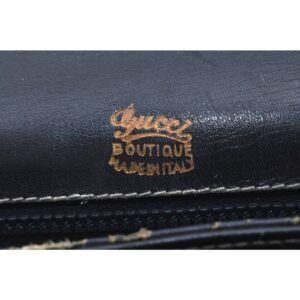 Gucci 60's navy leather saddle bag with gold logo clasp | AlmaBagz