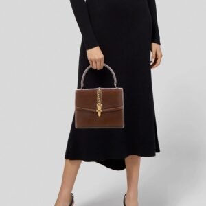 Gucci 1969 Sylvie chestnut brown leather top handle Kelly bag with a gold zipper accent | AlmaBagz