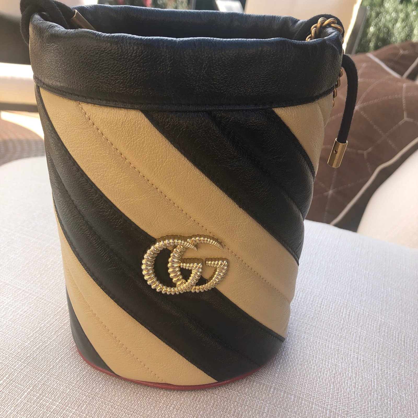Gucci GG Marmont Bucket Bag in Black and Beige with Red Trim | AlmaBagz