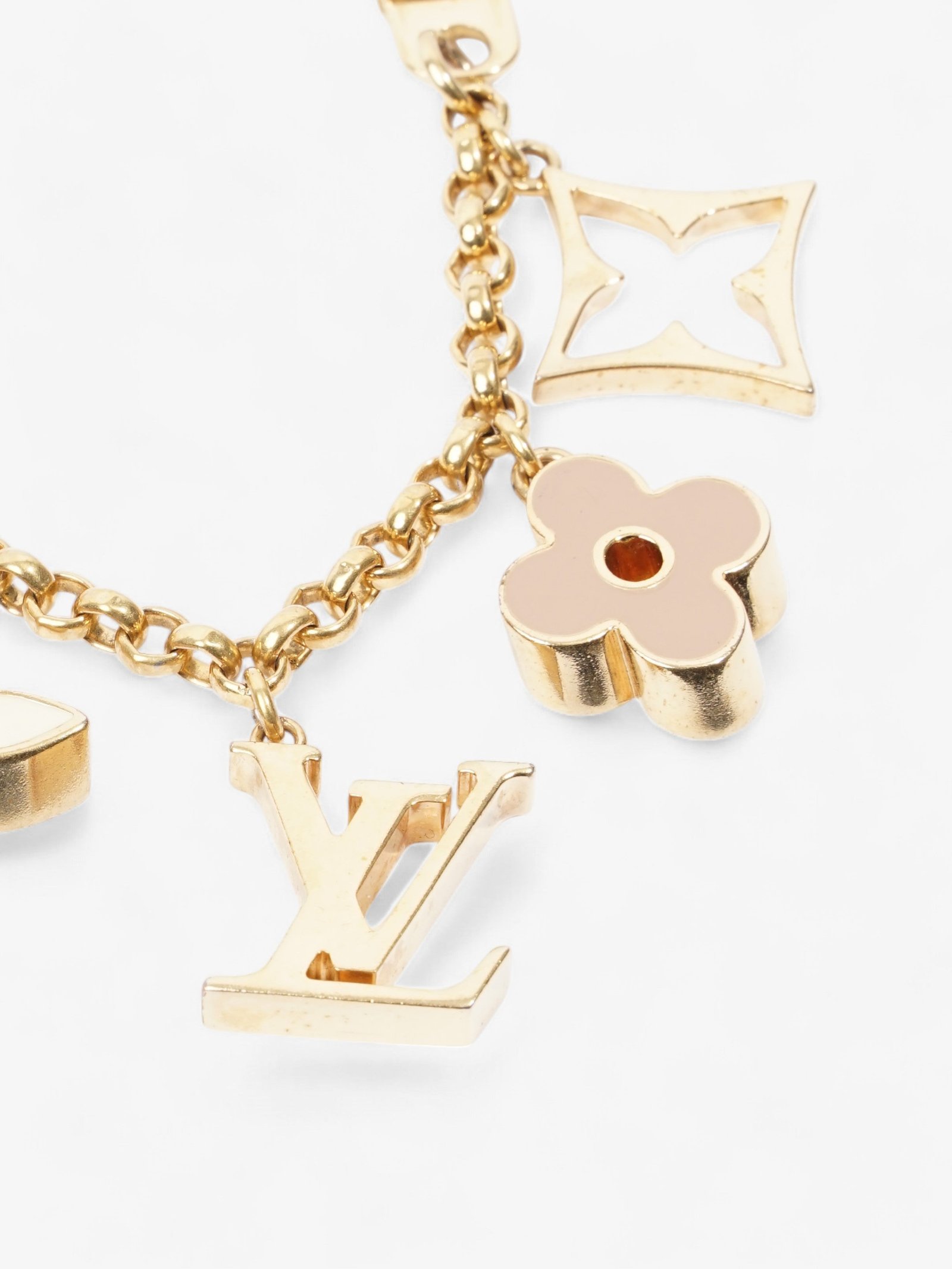 Louis Vuitton Monogram Bag Charm Gold Base Metal | AlmaBagz