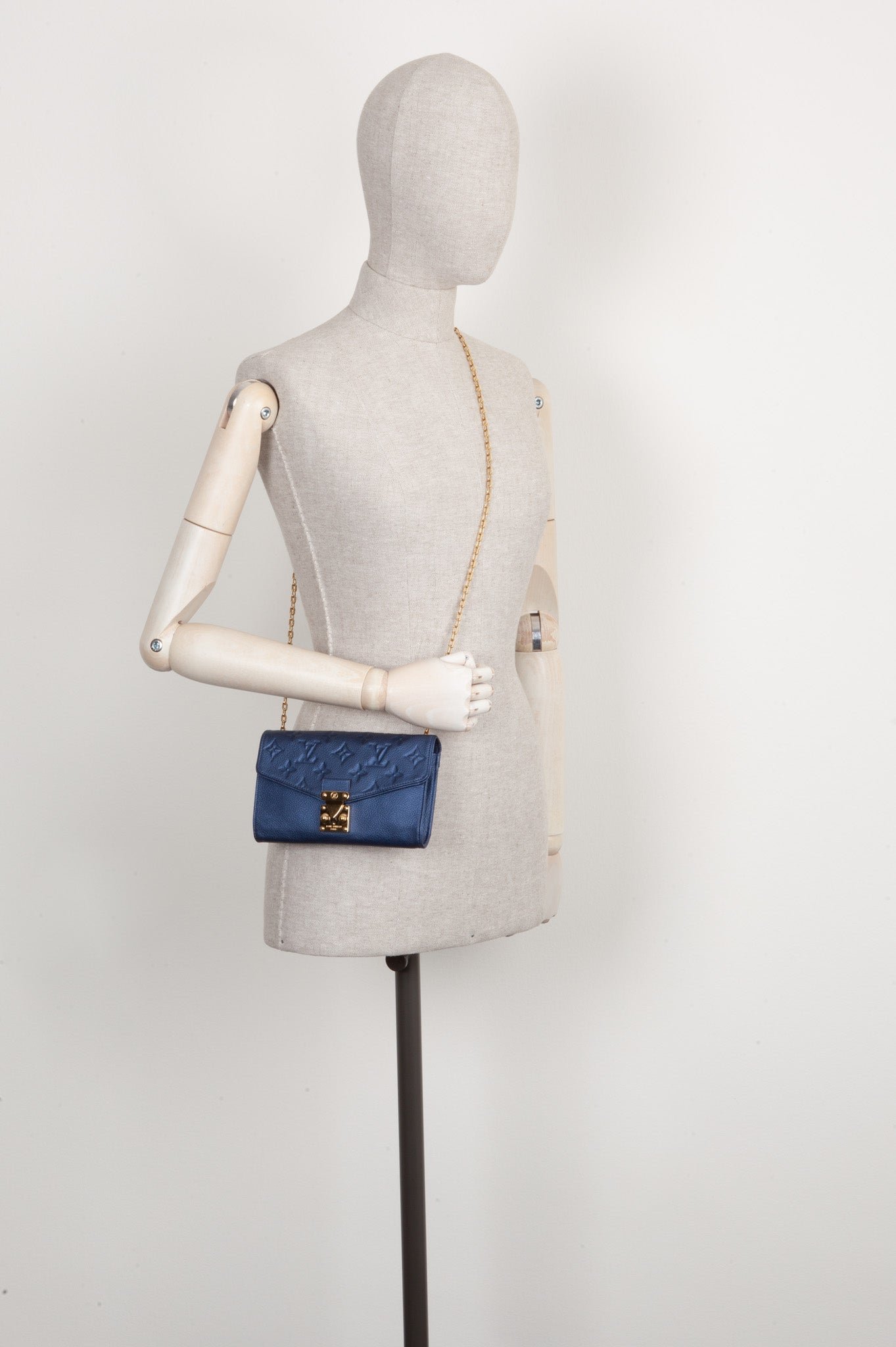 LOUIS VUITTON Saint Germain Pochette MNG Empreinte Leather Blue | AlmaBagz