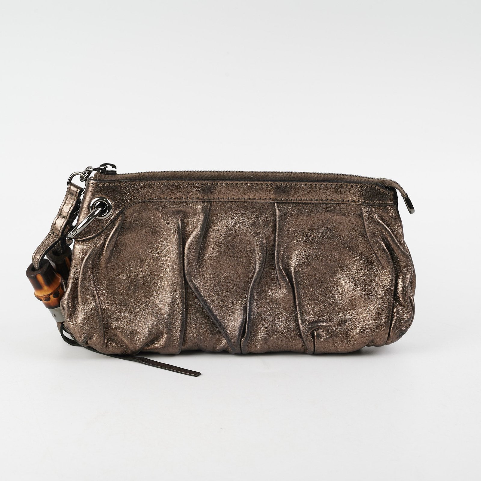 Gucci Metallic Bronze Tassel Pouch | AlmaBagz