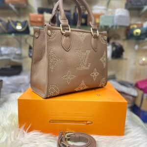 Louis Vuitton OnTheGo PM Monogram Empreinte Bag for Women (Brown) | AlmaBagz