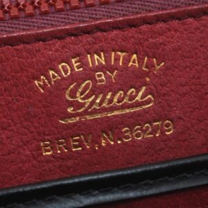 Gucci 1969 Sylvie  navy leather shoulder bag with a gold zipper accent | AlmaBagz