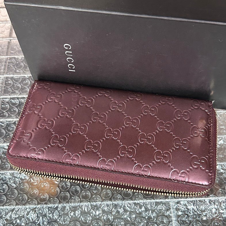 Gucci GG Embossed Burgundy Leather Wallet | AlmaBagz