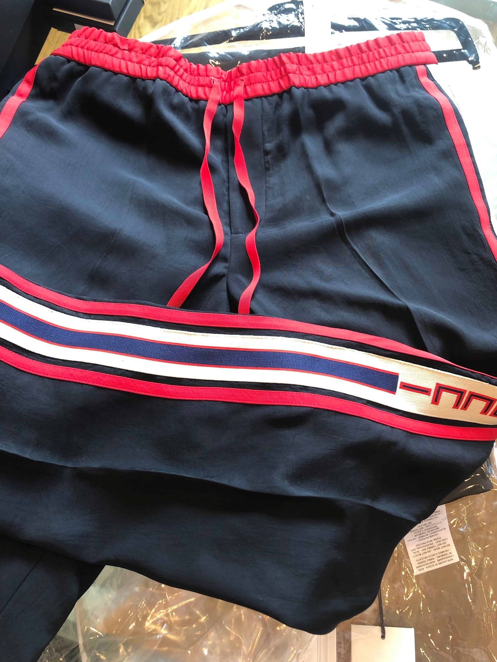 Gucci Side Logo Trim Jogger Pants in Black | AlmaBagz
